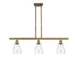 516-3I-BB-G394 3-Light 36" Brushed Brass Island Light - Seedy Ellery Glass - LED Bulb - Dimmensions: 36 x 5 x 10<br>Minimum Height : 19.375<br>Maximum Height : 43.375 - Sloped Ceiling Compatible: Yes
