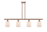 516-4I-AC-G111 4-Light 48" Antique Copper Island Light - Matte White Cobbleskill Glass - LED Bulb - Dimmensions: 48 x 5 x 10<br>Minimum Height : 19.375<br>Maximum Height : 43.375 - Sloped Ceiling Compatible: Yes