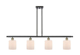 516-4I-BAB-G111 4-Light 48" Black Antique Brass Island Light - Matte White Cobbleskill Glass - LED Bulb - Dimmensions: 48 x 5 x 10<br>Minimum Height : 19.375<br>Maximum Height : 43.375 - Sloped Ceiling Compatible: Yes