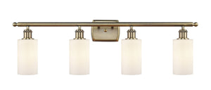 4-Light 36" Antique Brass Bath Vanity Light - Matte White Clymer Glass LED
