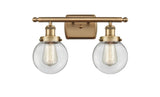 916-2W-BB-G202-6 2-Light 16" Brushed Brass Bath Vanity Light - Clear Beacon Glass - LED Bulb - Dimmensions: 16 x 7.5 x 11 - Glass Up or Down: Yes