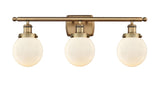 916-3W-BB-G201-6 3-Light 26" Brushed Brass Bath Vanity Light - Matte White Cased Beacon Glass - LED Bulb - Dimmensions: 26 x 7.5 x 11 - Glass Up or Down: Yes