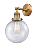 203-BB-G204-8 1-Light 8" Brushed Brass Sconce - Seedy Beacon Glass - LED Bulb - Dimmensions: 8 x 9.125 x 14 - Glass Up or Down: Yes