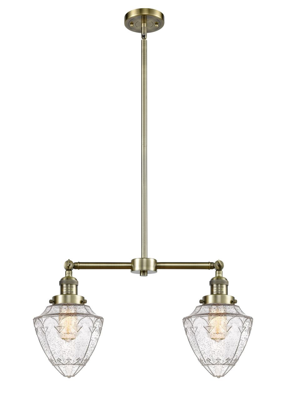 209-AB-G664-7 2-Light 24" Antique Brass Island Light - Seedy Small Bullet Glass - LED Bulb - Dimmensions: 24 x 7 x 15.25<br>Minimum Height : 24.25<br>Maximum Height : 48.25 - Sloped Ceiling Compatible: Yes