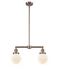 209-AC-G201-6 2-Light 23" Antique Copper Island Light - Matte White Cased Beacon Glass - LED Bulb - Dimmensions: 23 x 6 x 10<br>Minimum Height : 20.875<br>Maximum Height : 44.875 - Sloped Ceiling Compatible: Yes
