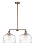 209-AC-G713-L 2-Light 21" Antique Copper Island Light - Clear Deco Swirl X-Large Bell Glass - LED Bulb - Dimmensions: 21 x 5 x 10<br>Minimum Height : 23.125<br>Maximum Height : 47.125 - Sloped Ceiling Compatible: Yes