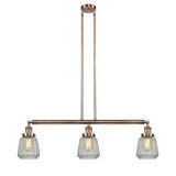 213-AC-G142 3-Light 38.75" Antique Copper Island Light - Clear Chatham Glass - LED Bulb - Dimmensions: 38.75 x 6.25 x 10<br>Minimum Height : 21<br>Maximum Height : 45 - Sloped Ceiling Compatible: Yes