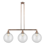 213-AC-G202-12 3-Light 44" Antique Copper Island Light - Clear Beacon Glass - LED Bulb - Dimmensions: 44 x 12 x 16<br>Minimum Height : 26<br>Maximum Height : 50 - Sloped Ceiling Compatible: Yes