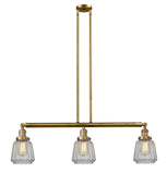 213-BB-G142 3-Light 38.75" Brushed Brass Island Light - Clear Chatham Glass - LED Bulb - Dimmensions: 38.75 x 6.25 x 10<br>Minimum Height : 21<br>Maximum Height : 45 - Sloped Ceiling Compatible: Yes