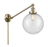 1-Light 10" Antique Brass Swing Arm - Seedy Beacon Glass LED - w/Switch