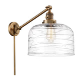 237-BB-G713-L 1-Light 12" Brushed Brass Swing Arm - Clear Deco Swirl X-Large Bell Glass - LED Bulb - Dimmensions: 12 x 12 x 13 - Glass Up or Down: Yes