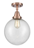 447-1C-AC-G204-10 1-Light 10" Antique Copper Flush Mount - Seedy Beacon Glass - LED Bulb - Dimmensions: 10 x 10 x 12.5 - Sloped Ceiling Compatible: No
