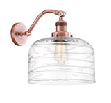 1-Light 12" Antique Copper Sconce - Clear Deco Swirl X-Large Bell Glass LED
