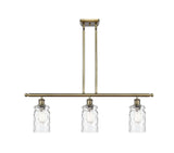 516-3I-AB-G352 3-Light 36" Antique Brass Island Light - Clear Waterglass Candor Glass - LED Bulb - Dimmensions: 36 x 5.5 x 11<br>Minimum Height : 20.375<br>Maximum Height : 44.375 - Sloped Ceiling Compatible: Yes
