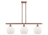 516-3I-AC-G121-8 3-Light 36" Antique Copper Island Light - Cased Matte White Athens Glass - LED Bulb - Dimmensions: 36 x 8 x 11<br>Minimum Height : 20.375<br>Maximum Height : 44.375 - Sloped Ceiling Compatible: Yes