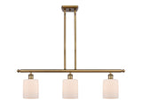 516-3I-BB-G111 3-Light 36" Brushed Brass Island Light - Matte White Cobbleskill Glass - LED Bulb - Dimmensions: 36 x 5 x 10<br>Minimum Height : 19.375<br>Maximum Height : 43.375 - Sloped Ceiling Compatible: Yes