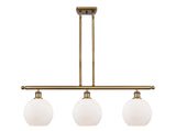 516-3I-BB-G121-8 3-Light 36" Brushed Brass Island Light - Cased Matte White Athens Glass - LED Bulb - Dimmensions: 36 x 8 x 11<br>Minimum Height : 20.375<br>Maximum Height : 44.375 - Sloped Ceiling Compatible: Yes