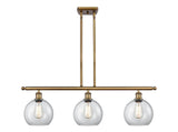 516-3I-BB-G122-8 3-Light 36" Brushed Brass Island Light - Clear Athens Glass - LED Bulb - Dimmensions: 36 x 8 x 11<br>Minimum Height : 20.375<br>Maximum Height : 44.375 - Sloped Ceiling Compatible: Yes