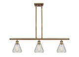 516-3I-BB-G275 3-Light 36" Brushed Brass Island Light - Clear Crackle Conesus Glass - LED Bulb - Dimmensions: 36 x 6 x 11<br>Minimum Height : 20.375<br>Maximum Height : 44.375 - Sloped Ceiling Compatible: Yes