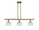 516-3I-BB-G412 3-Light 36" Brushed Brass Island Light - Clear Dayton Glass - LED Bulb - Dimmensions: 36 x 5.5 x 9.5<br>Minimum Height : 19.375<br>Maximum Height : 43.375 - Sloped Ceiling Compatible: Yes