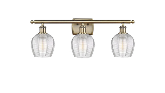 516-3W-AB-G462-6 3-Light 25.75" Antique Brass Bath Vanity Light - Clear Norfolk Glass - LED Bulb - Dimmensions: 25.75 x 7 x 10 - Glass Up or Down: Yes