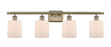 4-Light 36" Antique Brass Bath Vanity Light - Matte White Cobbleskill Glass LED