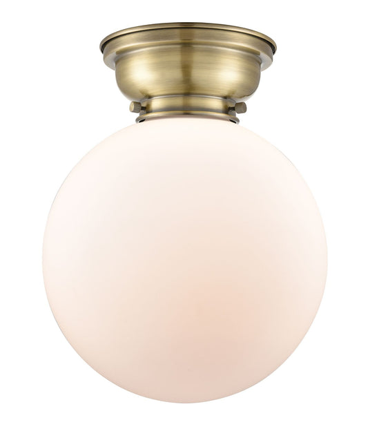 1-Light 10" Antique Brass Flush Mount - Matte White Cased Beacon Glass LED