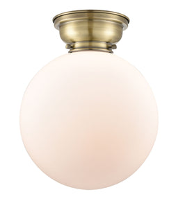 1-Light 12" Antique Brass Flush Mount - Matte White Cased Beacon Glass LED