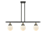 916-3I-BAB-G201-6 3-Light 36" Black Antique Brass Island Light - Matte White Cased Beacon Glass - LED Bulb - Dimmensions: 36 x 6 x 10<br>Minimum Height : 19.375<br>Maximum Height : 43.375 - Sloped Ceiling Compatible: Yes