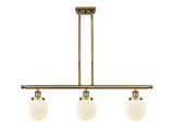 916-3I-BB-G201-6 3-Light 36" Brushed Brass Island Light - Matte White Cased Beacon Glass - LED Bulb - Dimmensions: 36 x 6 x 10<br>Minimum Height : 19.375<br>Maximum Height : 43.375 - Sloped Ceiling Compatible: Yes