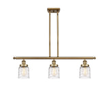 916-3I-BB-G513 3-Light 36" Brushed Brass Island Light - Clear Deco Swirl Small Bell Glass - LED Bulb - Dimmensions: 36 x 5 x 10<br>Minimum Height : 19.375<br>Maximum Height : 43.375 - Sloped Ceiling Compatible: Yes