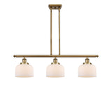 916-3I-BB-G71 3-Light 36" Brushed Brass Island Light - Matte White Cased Large Bell Glass - LED Bulb - Dimmensions: 36 x 8 x 11<br>Minimum Height : 20.375<br>Maximum Height : 44.375 - Sloped Ceiling Compatible: Yes