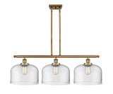 916-3I-BB-G72-L 3-Light 36" Brushed Brass Island Light - Clear X-Large Bell Glass - LED Bulb - Dimmensions: 36 x 8 x 11<br>Minimum Height : 20.375<br>Maximum Height : 44.375 - Sloped Ceiling Compatible: Yes