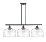 916-3I-OB-G713-L 3-Light 36" Oil Rubbed Bronze Island Light - Clear Deco Swirl X-Large Bell Glass - LED Bulb - Dimmensions: 36 x 8 x 11<br>Minimum Height : 20.375<br>Maximum Height : 44.375 - Sloped Ceiling Compatible: Yes