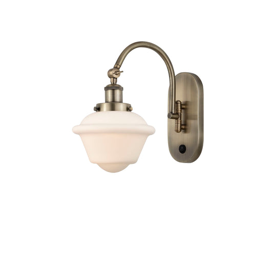 1-Light 7.5" Antique Brass Sconce - Matte White Cased Small Oxford Glass LED