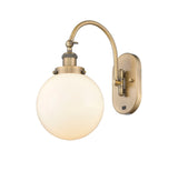 1-Light 8" Antique Brass Sconce - Matte White Cased Beacon Glass LED